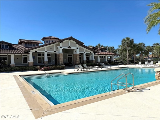 view of swimming pool featuring a patio area