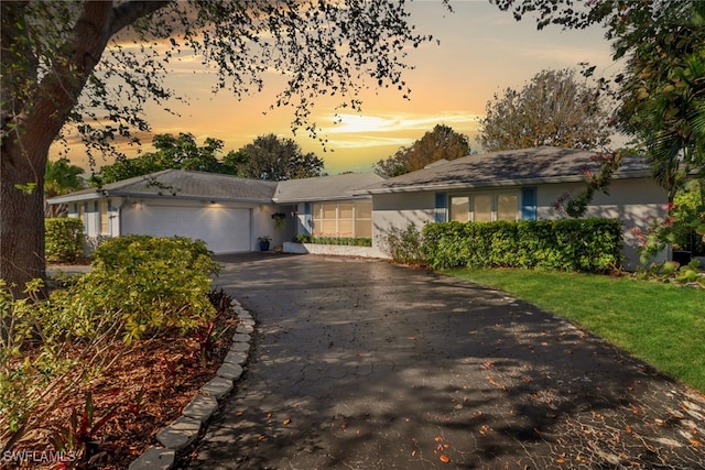 single story home featuring a garage