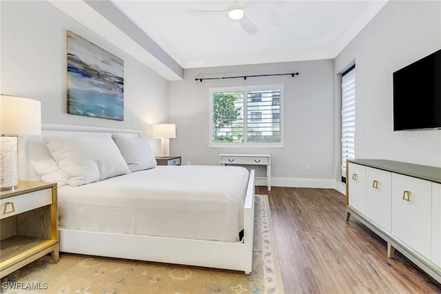 bedroom with ceiling fan and light hardwood / wood-style floors