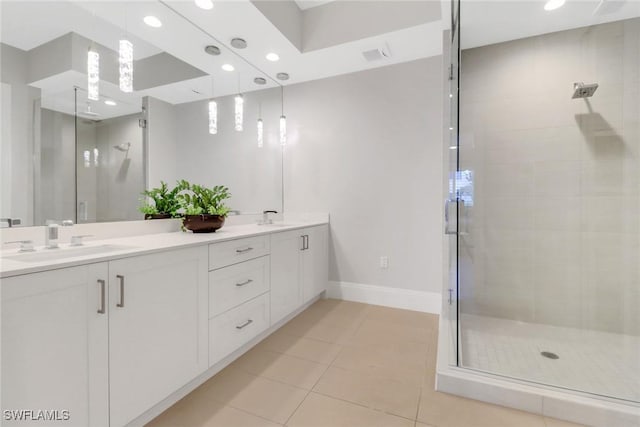 bathroom with vanity, tile patterned floors, and walk in shower