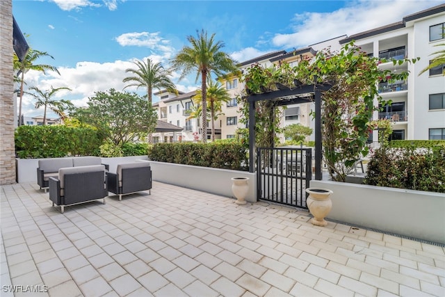 view of patio featuring an outdoor living space and a pergola