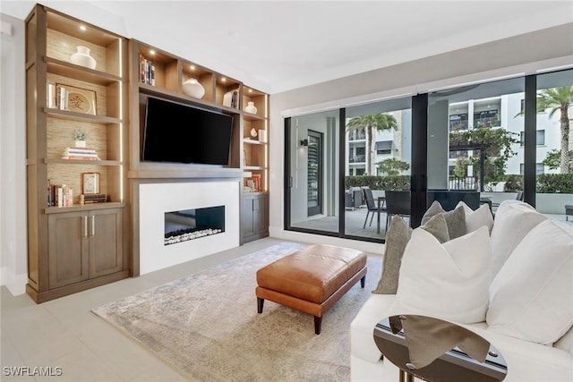 living room featuring tile patterned flooring and built in shelves