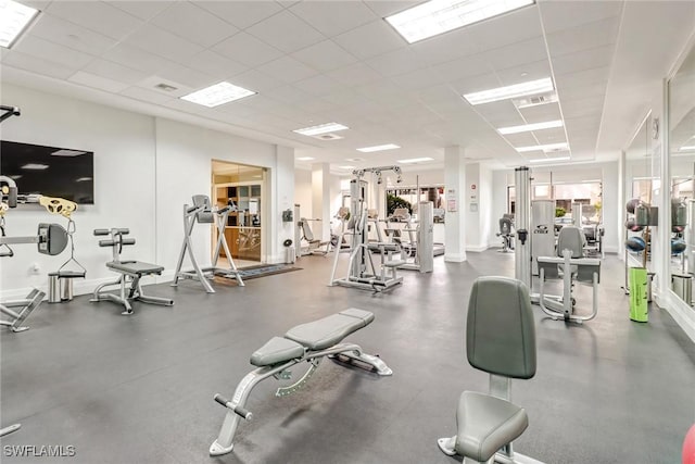 workout area with a drop ceiling