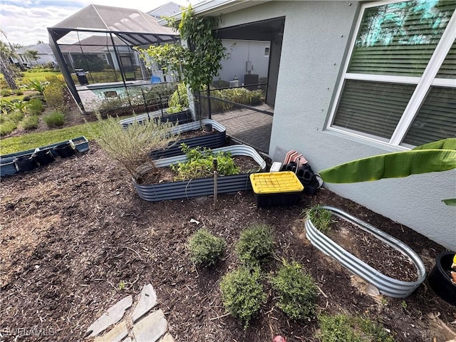 view of yard with glass enclosure