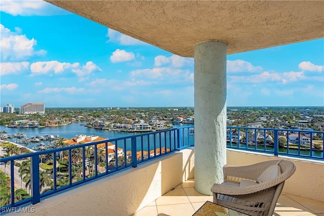 balcony featuring a water view