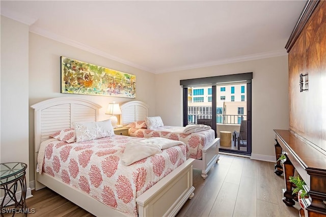 bedroom featuring access to outside, baseboards, light wood-style flooring, and crown molding