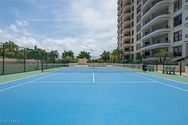 view of sport court with fence