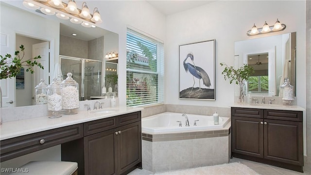 bathroom with tile patterned flooring, plus walk in shower, and vanity