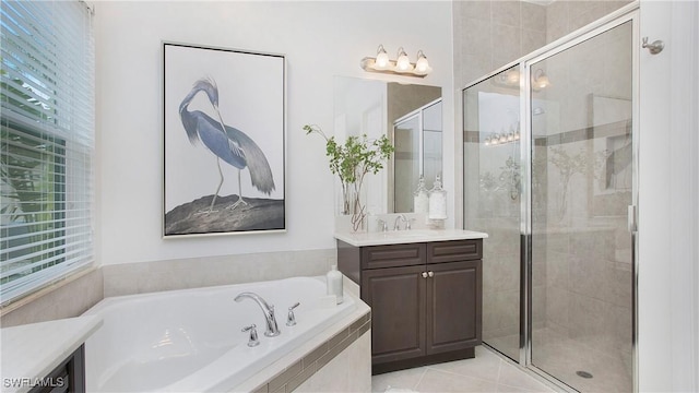 bathroom with independent shower and bath, vanity, and tile patterned flooring