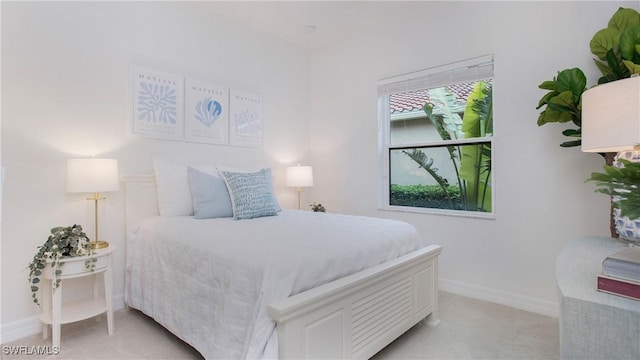 bedroom with light carpet