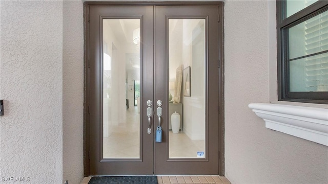 property entrance featuring french doors