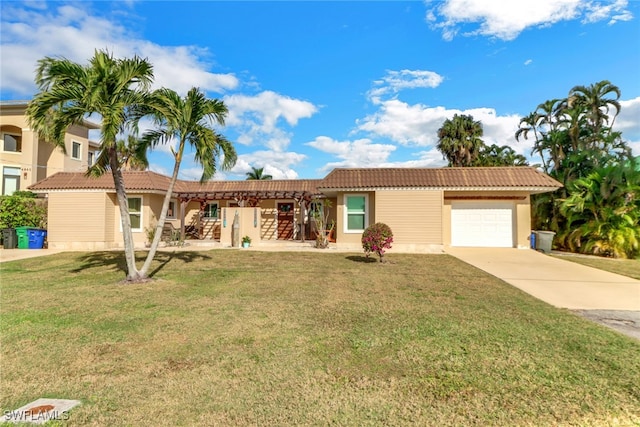 view of front of house featuring a garage and a front yard