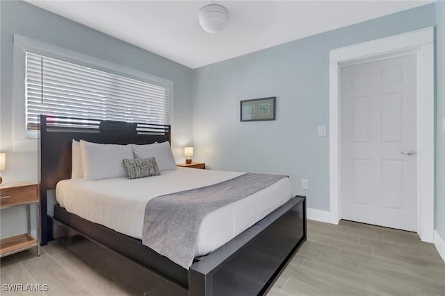 bedroom with light hardwood / wood-style flooring