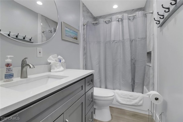 bathroom featuring vanity, toilet, and hardwood / wood-style floors