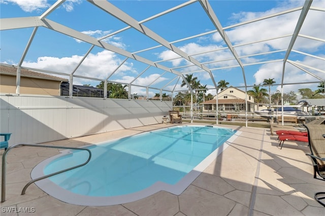 view of pool with a lanai and a patio area