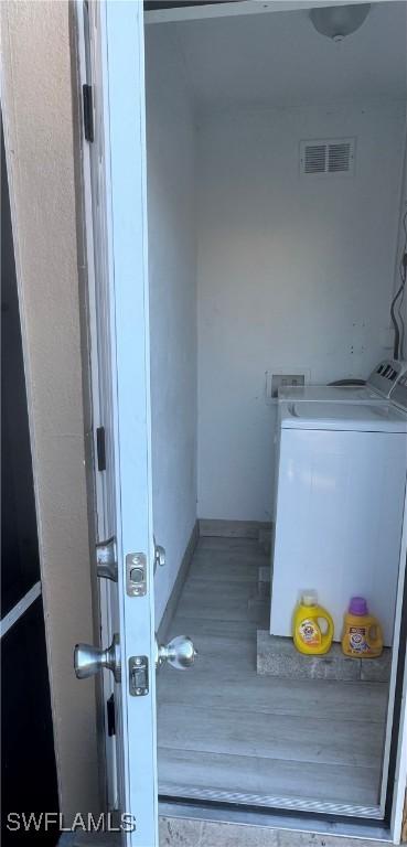 exterior space with independent washer and dryer