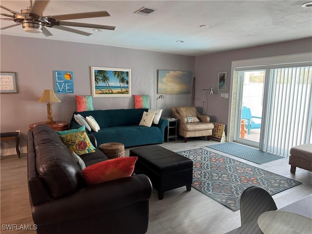 living room featuring ceiling fan