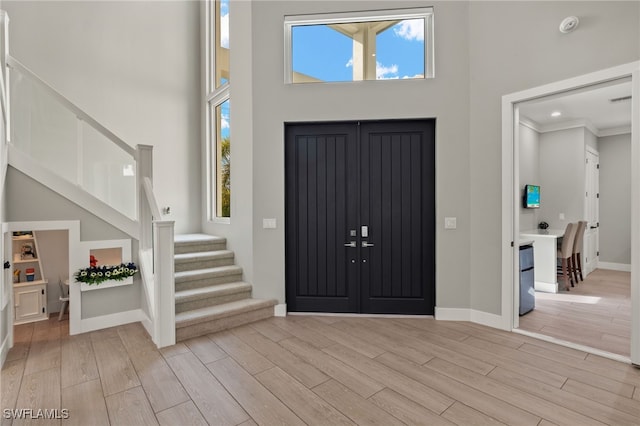 entryway with a high ceiling