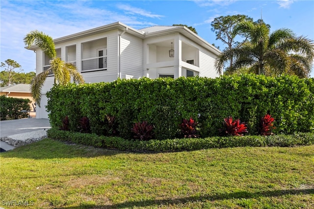 view of property exterior featuring a yard