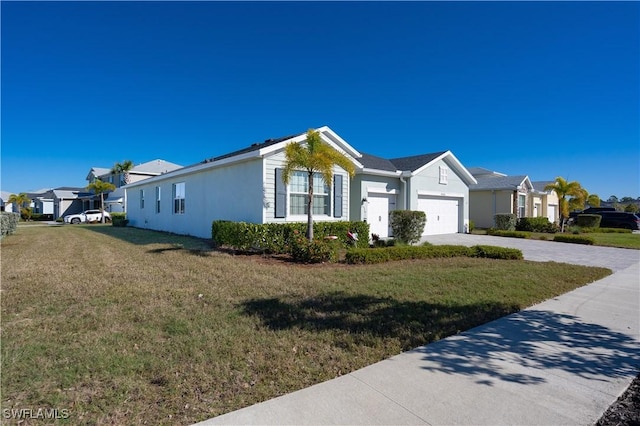 single story home with a garage and a front lawn