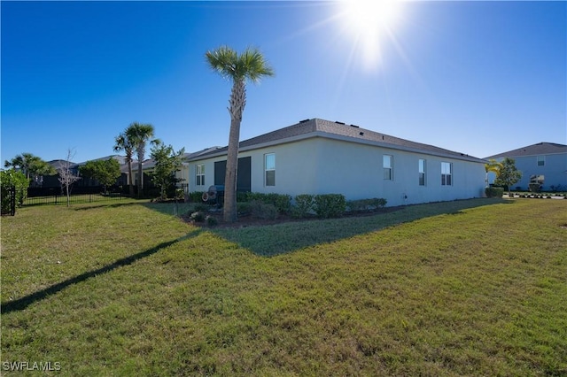 view of side of property featuring a yard