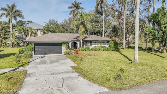 ranch-style house featuring a garage and a front yard