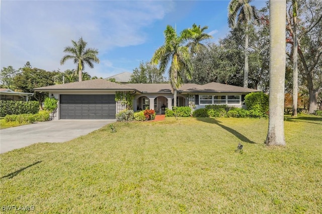 ranch-style house with a garage and a front lawn