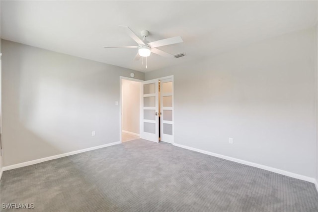 spare room with ceiling fan and carpet flooring