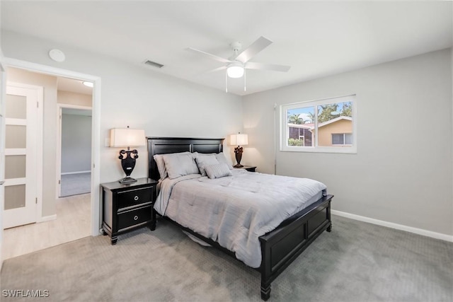 bedroom featuring light carpet and ceiling fan