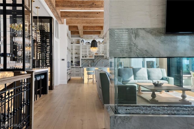 interior space featuring hardwood / wood-style floors and beam ceiling