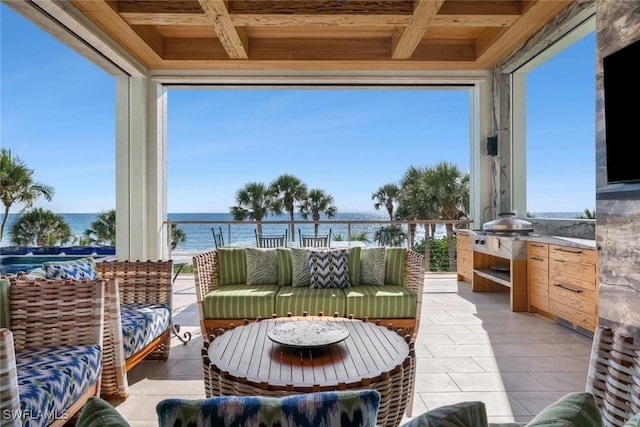 sunroom with a water view and wood ceiling