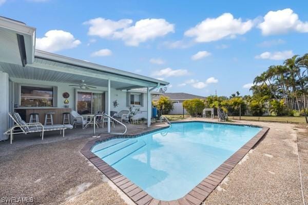 view of pool featuring a patio and ceiling fan