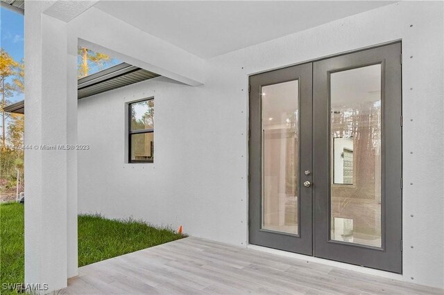 4091 56th Ave NE, Naples, FL 34120 - property entrance featuring french doors and stucco siding
