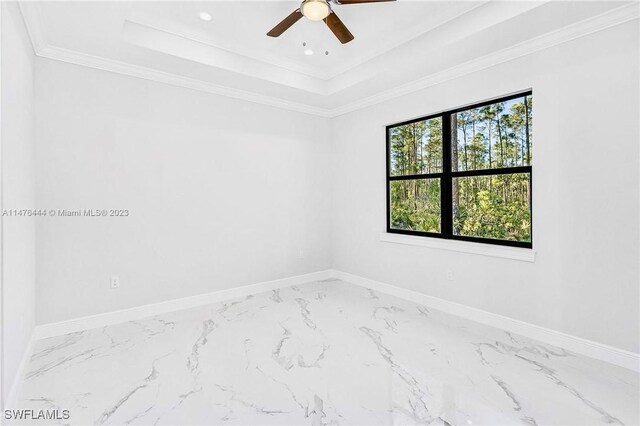 4091 56th Ave NE, Naples, FL 34120 - spare room with marble finish floors, a tray ceiling, baseboards, a ceiling fan, and recessed lighting