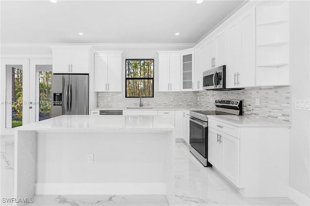4091 56th Ave NE, Naples, FL 34120 - kitchen with stainless steel appliances, open shelves, light marble finish flooring, a sink, and a center island