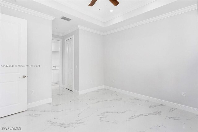 4091 56th Ave NE, Naples, FL 34120 - empty room with a ceiling fan, light marble finish flooring, baseboards, and crown molding
