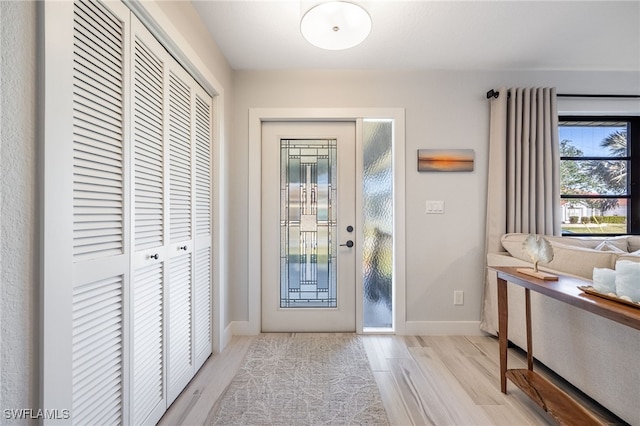 entryway with light hardwood / wood-style flooring