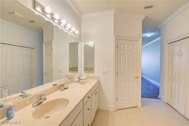 13911 Lake Mahogany Blvd Unit 2922, Fort Myers, FL 33907 - bathroom featuring crown molding, a sink, tile patterned floors, and double vanity