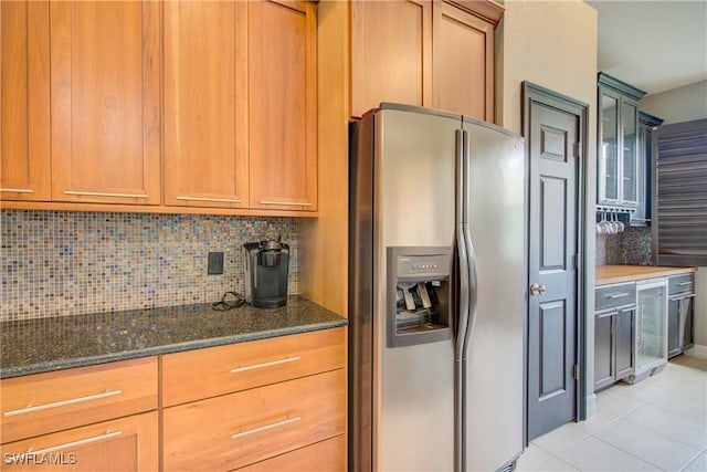 13911 Lake Mahogany Blvd Unit 2922, Fort Myers, FL 33907 - kitchen featuring stainless steel refrigerator with ice dispenser, tasteful backsplash, dark stone countertops, beverage cooler, and light tile patterned flooring