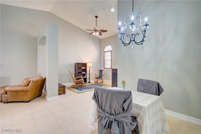 13911 Lake Mahogany Blvd Unit 2922, Fort Myers, FL 33907 - dining room featuring lofted ceiling, light tile patterned flooring, baseboards, arched walkways, and ceiling fan with notable chandelier