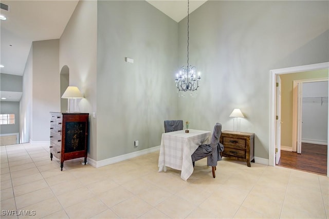 13911 Lake Mahogany Blvd Unit 2922, Fort Myers, FL 33907 - office area with visible vents, tile patterned flooring, high vaulted ceiling, baseboards, and a notable chandelier