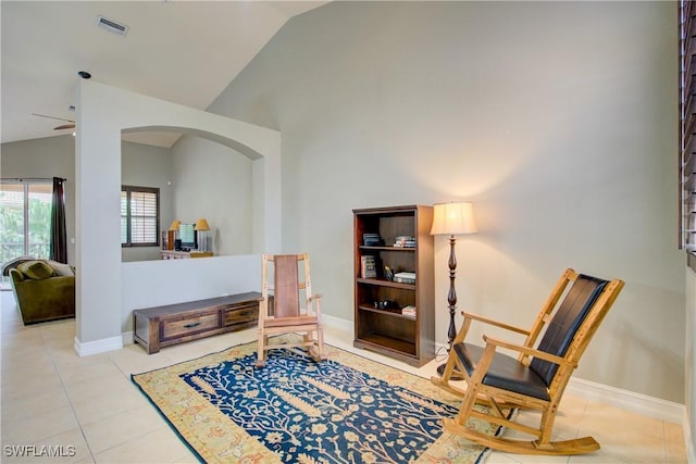 13911 Lake Mahogany Blvd Unit 2922, Fort Myers, FL 33907 - sitting room with visible vents, arched walkways, lofted ceiling, and tile patterned floors