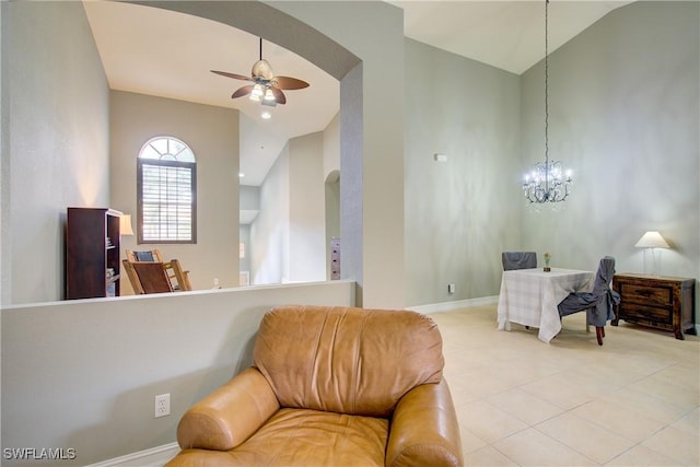 13911 Lake Mahogany Blvd Unit 2922, Fort Myers, FL 33907 - living area with arched walkways, tile patterned floors, baseboards, and ceiling fan with notable chandelier