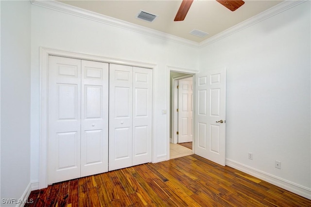 13911 Lake Mahogany Blvd Unit 2922, Fort Myers, FL 33907 - unfurnished bedroom with baseboards, wood finished floors, visible vents, ornamental molding, and a closet