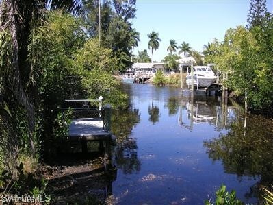 property view of water featuring a dock