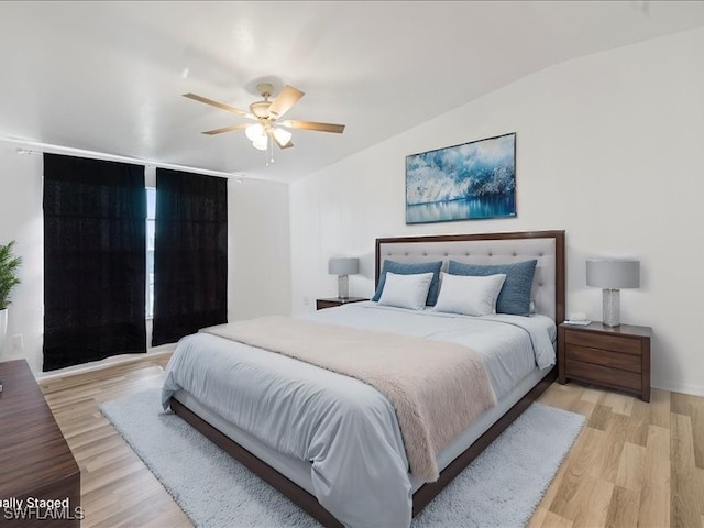 bedroom featuring ceiling fan and light hardwood / wood-style floors