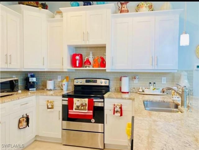 kitchen featuring stainless steel appliances, sink, hanging light fixtures, and backsplash