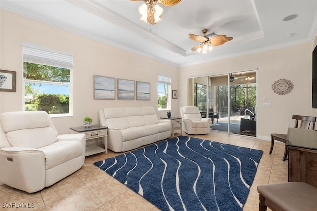10696 Camarelle Cir, Fort Myers, FL 33913 - tiled living room with ceiling fan, crown molding, and a tray ceiling