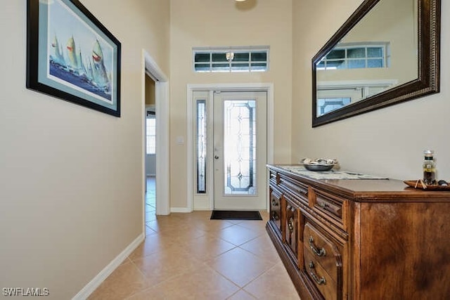 foyer with light tile patterned floors