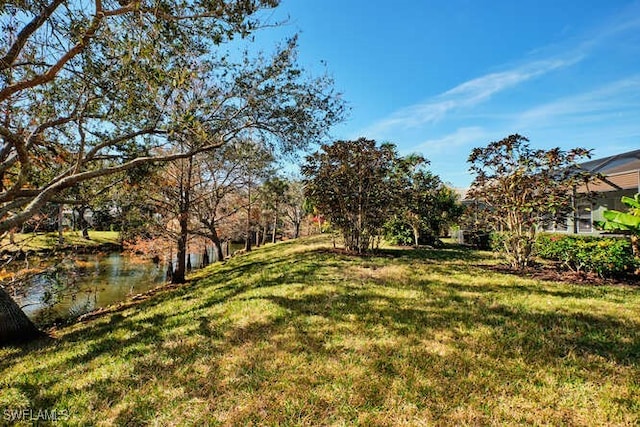 view of yard with a water view